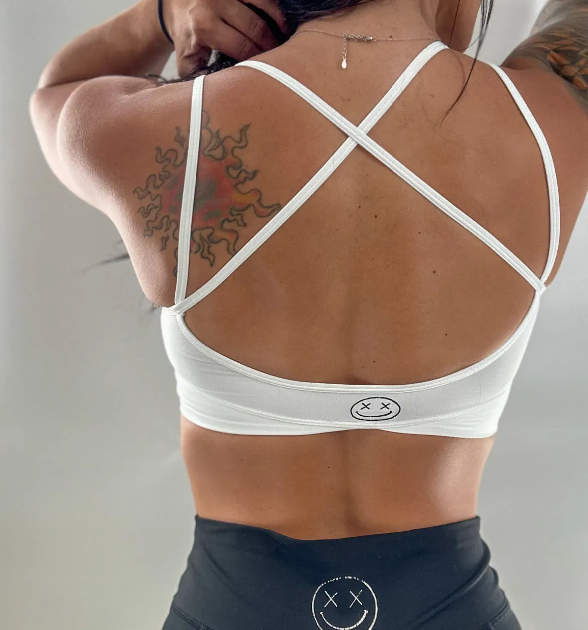 Salty Savage Ladies "Fuck Off" V Cut Sports Bra | White/Pink